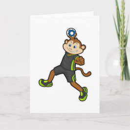 Aap als handbalspeler met handbal kaart