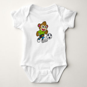 Aap als voetballer met voetbal romper