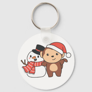 aap met sneeuwman in de winter voor kerstkeycha sleutelhanger