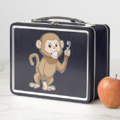 aap met tandenborstel (In situ)