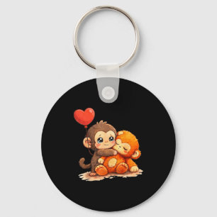 Aap slaat baby schattige baby grappig dier grote l sleutelhanger