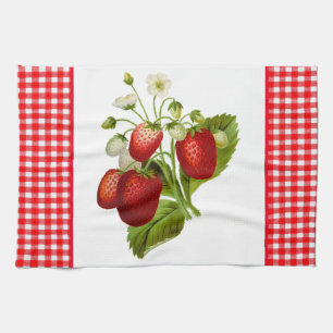Aardbeien met rode geruite keukenhanddoek
