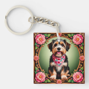 Aardige hond omlijst door kleurrijke bloemen sleutelhanger