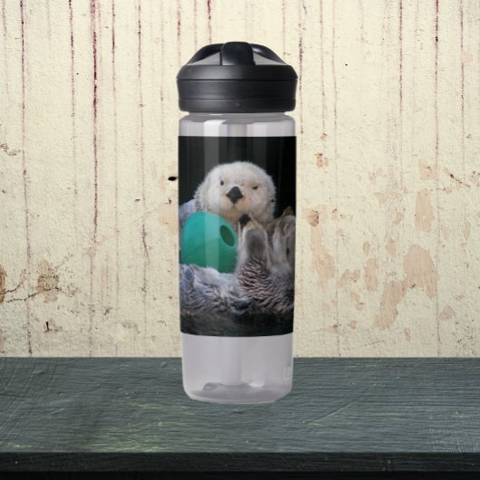 Aardige speelse zeeotters foto waterfles