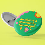 Abortus is een fundamentele mensenrechtenfeministe ronde button 5,7 cm<br><div class="desc">Abortus is een fundamenteel mensenrecht,  geschreven in retro geel lettertype op een funky hippie stijl knop voor een pro-keuze feministe. Show van je leuke geest met deze schattige groene knop met  bloemen terwijl je opkomt voor vrouwenrechten en de pro-keuze beweging.</div>