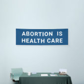 Abortus is een protestactie tegen vrouwenrechten i spandoek (Beurs)