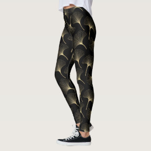 Abstract bladpatroon met zwart en licht goud leggings