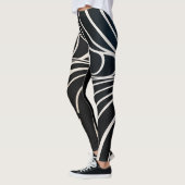 Abstract patroon met zwarte en witte golvende lijn leggings (Links)