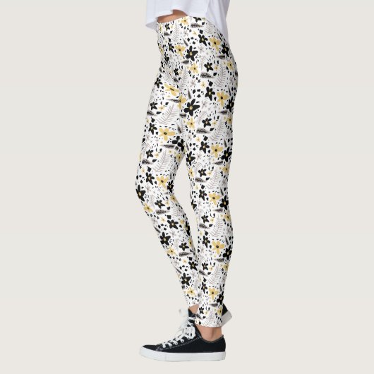 Abstract zwart geel grijs bloemmotief leggings (Links)