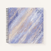 Abstracte blauwe en beige verfstreken in een romme notitieboek (Voorkant)