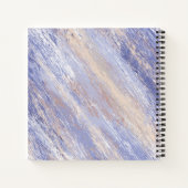Abstracte blauwe en beige verfstreken in een romme notitieboek (Achterkant)