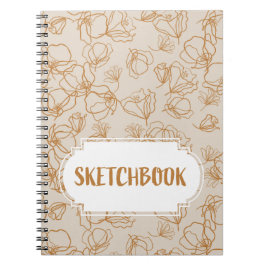 Abstracte bloemen boven beige notitieboek