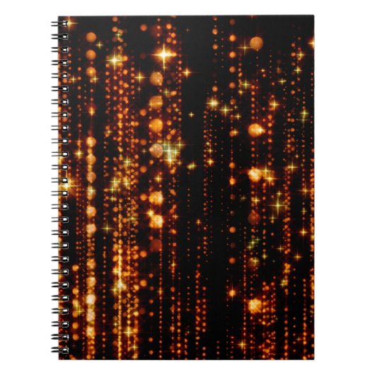 Abstracte gouden regen met heldere deeltjes met ee notitieboek (Voorkant)