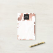 Abstracte goudpenseelstreken van Roos op wit Post-it® Notes (Op bureau)