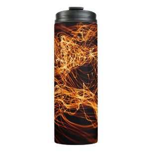 Abstracte goudverlichting thermosbeker