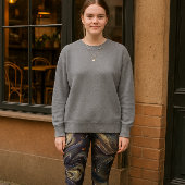 Abstracte koperen veren print op zwart leggings