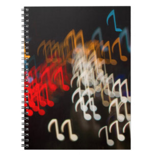Abstracte muzieknoten: Lichten Bokeh achtergrond Notitieboek