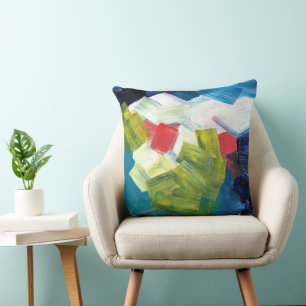 Abstracte penseelstreken in blauw, groen en rood kussen