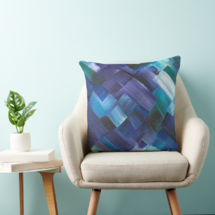 Abstracte penseelstreken in blauw, turquoise en pa kussen