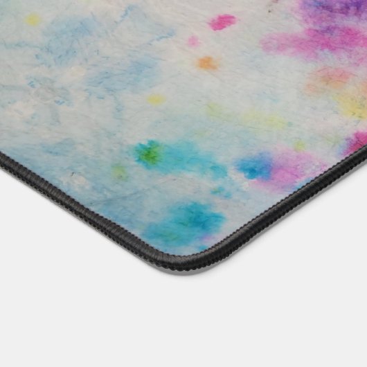 Abstracte regenboogverfplaat bureaumat (Hoek)