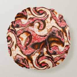 Abstracte rode en koraalvlekken met een houtachtig rond kussen