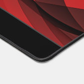 Abstracte rode en zwarte vloeiende vormen en verlo bureaumat (Hoek)