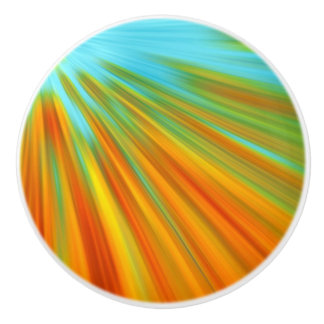 Abstracte rode gele oranje groene strepen op blauw keramische knop