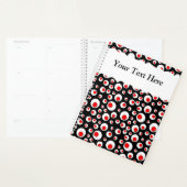 Abstracte rode rode witte cirkels op zwart planner (Display)