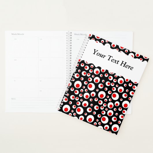 Abstracte rode rode witte cirkels op zwart planner (Display)