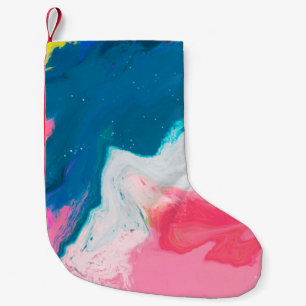 Abstracte roze en turkooisverf achtergrond met kleine kerstsok