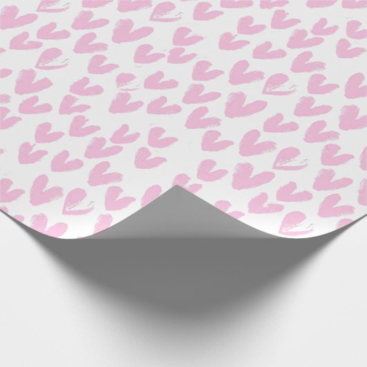 Abstracte roze harten op wit cadeaupapier (Hoek)