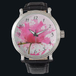 Abstracte verfplaat met roze ventilator horloge<br><div class="desc">bloem met roze bladen die in roze verfsplatters op een grote witte muur achter ontploffen. Grote druppels verf worden over de hele linie besproeid. Koel modern abstract hedendaags design.</div>