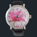 Abstracte verfplaat met roze ventilator horloge<br><div class="desc">bloem met roze bladen die in roze verfsplatters op een grote witte muur achter ontploffen. Grote druppels verf worden over de hele linie besproeid. Koel modern abstract hedendaags design.</div>