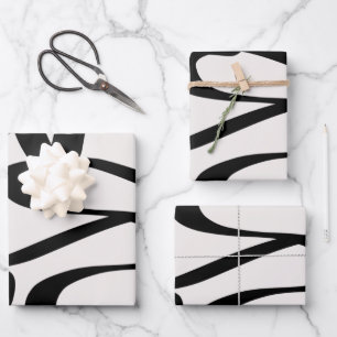 Abstracte wervelkolommen vormen zwart en beige crè inpakpapier vel