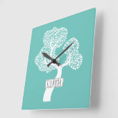 Abstracte witte cirkelboom en noem blauwgroen lich vierkante klok (Hoek)