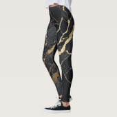 Abstracte zwart-gouden marmeren print leggings (Links)
