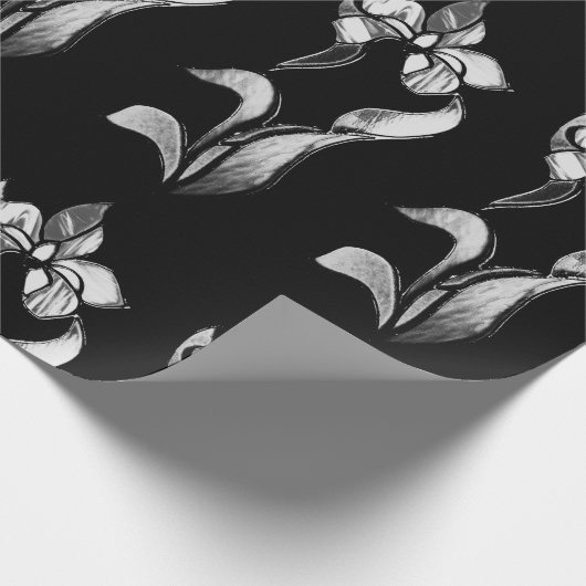 Abstracte zwarte witte glanzende bloemen op zwart cadeaupapier (Hoek)