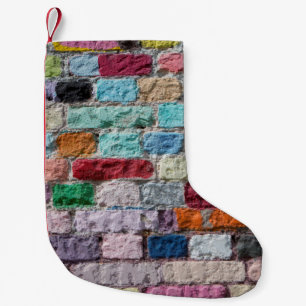Achtergrond van de geverfde textuur van de kleuren kleine kerstsok