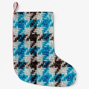 Achtergrond van de textuur van de flannelstof. kleine kerstsok