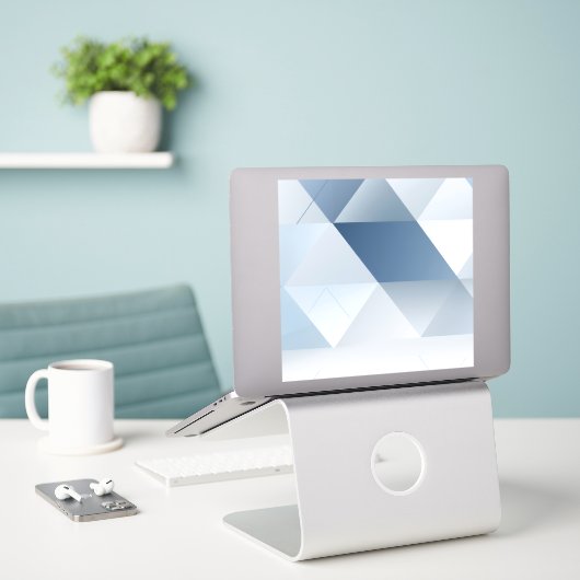 Achtergrond van grijze driehoeken met tekstruimte sticker (Laptop op bureau)