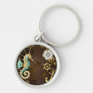 Achtergrond van hout met mechanische zeepaardjes sleutelhanger