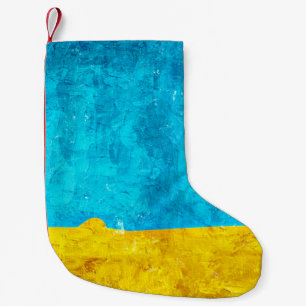 Achtergrondblauwe gele kunst kleine kerstsok