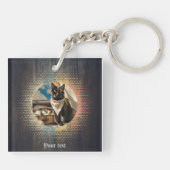 Activiteiten in de omgeving van kat Buccaneer's Su Sleutelhanger (Achterkant)