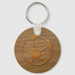 Afdruk van voetbal uitgesneden in hout sleutelhanger