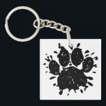 Afdrukken zwart verfplaat verfplaat verf sleutelhanger<br><div class="desc">De de stijlhondenpootdruk van de cartoon van de klap met verfspatten en onderdrukt effect dat op afbeelding wordt toegepast. Aangepaste sleutelketens. Cadeauidee voor hondenliefhebbers.</div>