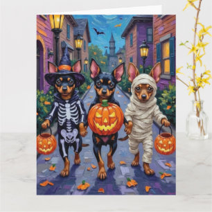 Affenpinscher honden gaan langs voor trick-or-trea kaart