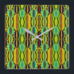 Afrocentric Geometric Cowrie Shells Vierkante Klok<br><div class="desc">Bring cultural artistry and modern geometry together with this Afrocentric Geometric Cowrie Shells Square Wall Clock. Designed in an earthy blend of green, orange, blue, burgundy and black, the motif highlights the symbolic beauty of cowrie shells while introducing a structured, contemporary pattern. The result is a striking wall accent that...</div>