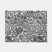 Afsnijdsels in zwart-wit deurmat (Voorkant)