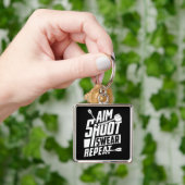 AIM Shoot Swear Herhaal Premium Sleutelhanger (Hand)