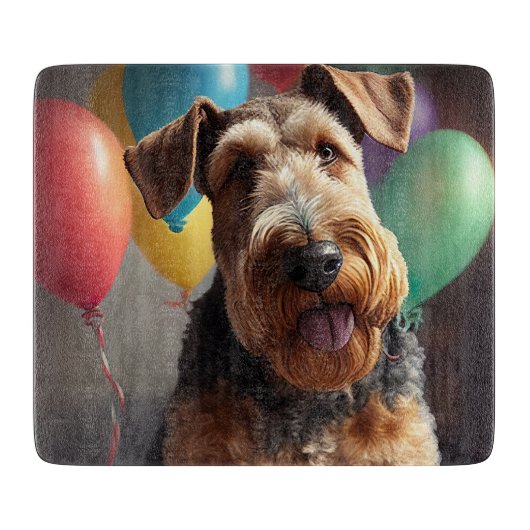 Airedale-hond met cake en ballonnen snijplank (Voorkant)